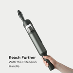 Guu Vision 2.0 cordless vacuum with an extension wand attached for reaching high corners and deep spaces.