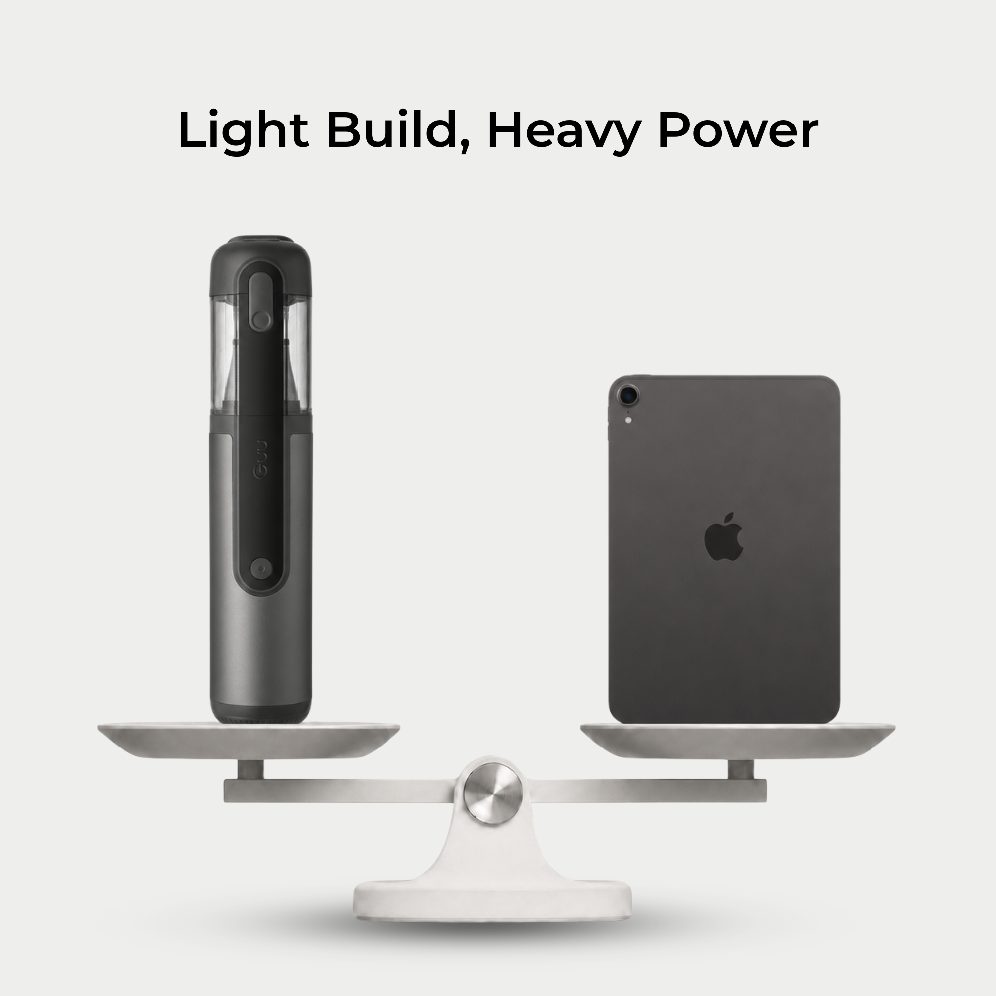 Guu Vision 2.0 lightweight cordless vacuum balanced on a scale with an iPad, demonstrating its ultra-lightweight design for easy handling.
