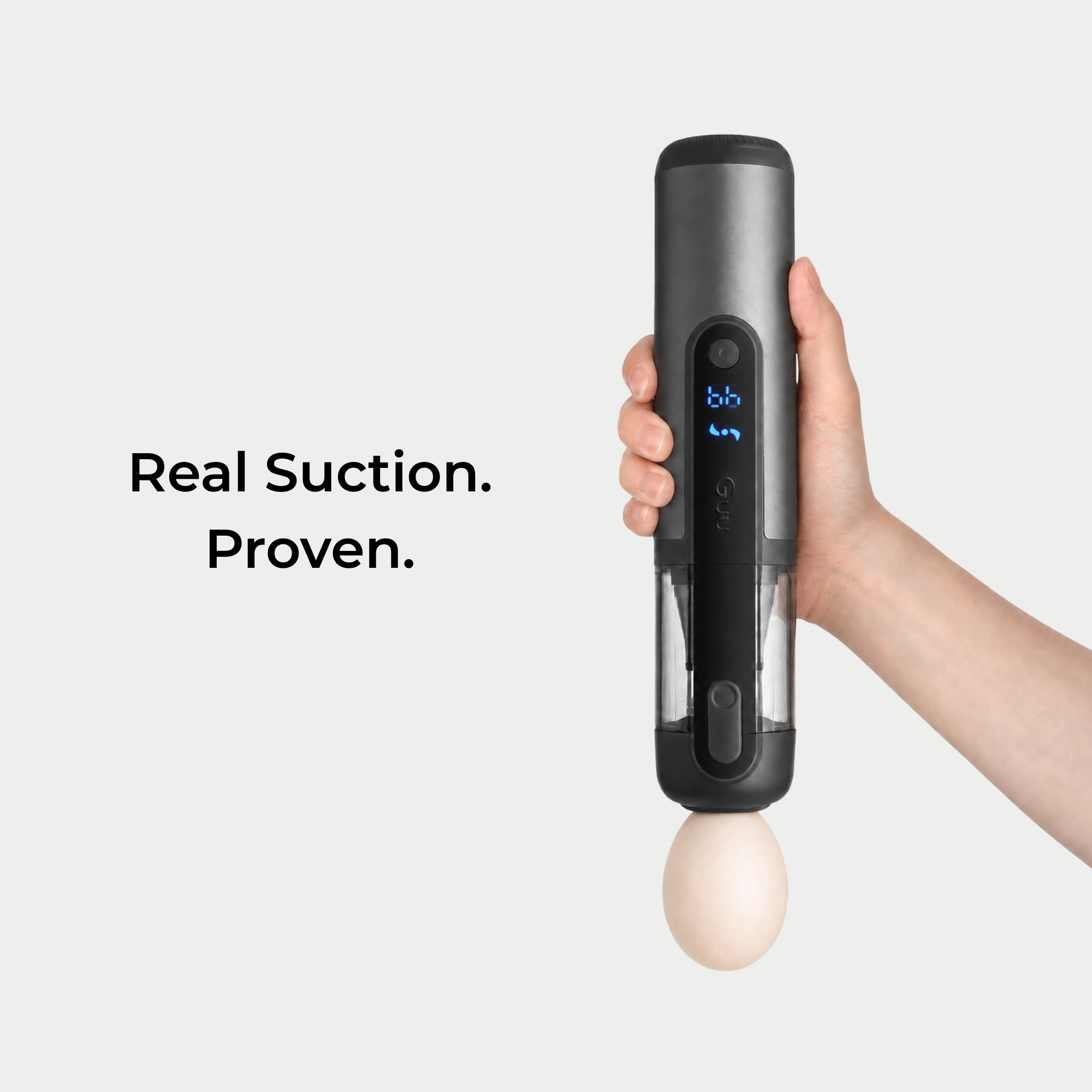 Demonstration of the Guu Vision 2.0 powerful suction effortlessly lifting a heavy egg, proving its deep cleaning capabilities.